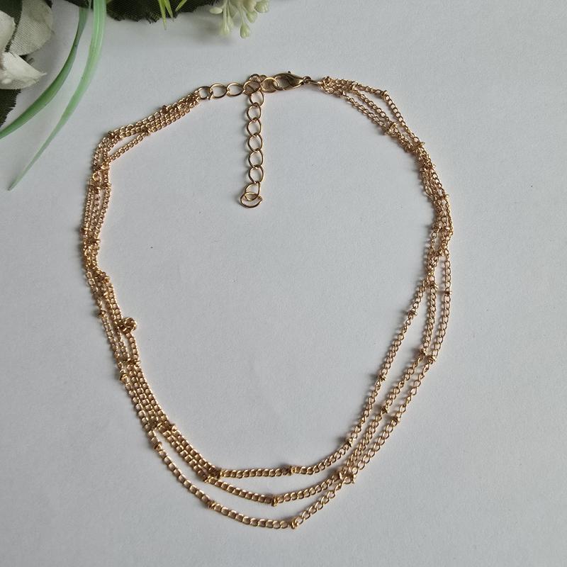 Aranyszínű 3 soros nyaklánc apró gyöngyökkel