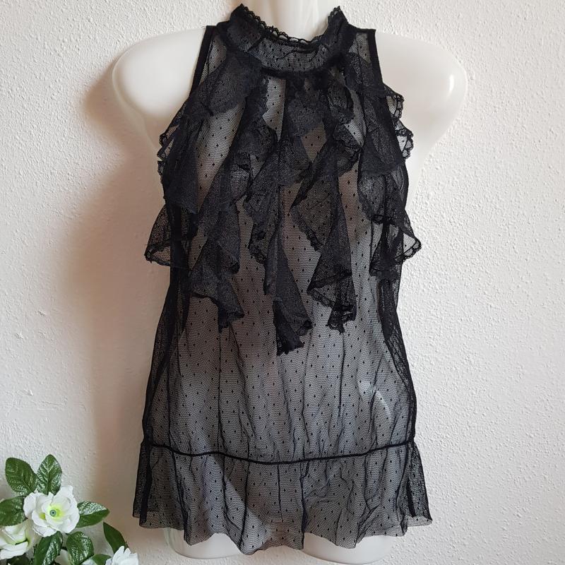 M-es fekete színű, fodros, pöttyös ujjatlan blúz, felső