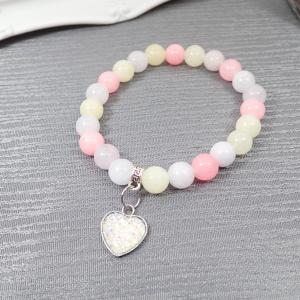 Karkötő lágy színekből, szívecskével