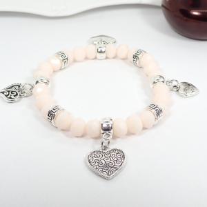 Karkötő négy szívecskével, barackszín