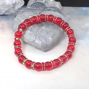 Piros, csillogó karkötő