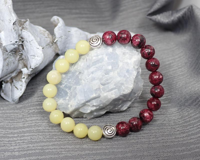 Karkötő csigamintás diszekkel