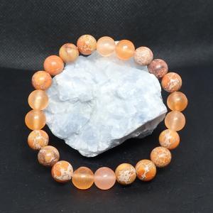 Barackszín jáde és regalit karkötő