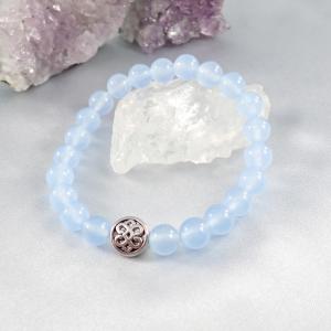 Halványkék jáde karkötő fém gyönggyel