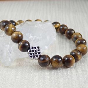 Tigrisszem karkötő végtelen csomó dísszel