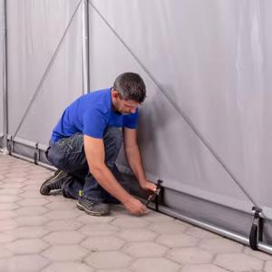 Professzionális ponyva csarnok  raktársátor, ipari sátor  8x16m oldalmagasság 4,00m felhúzható kapuval, tetőablakkal, ponyva lángálló  PVC szürke