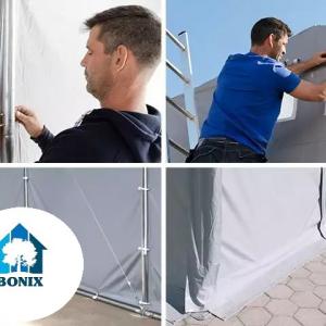 Professzionális raktársátor ipari sátor 6 × 12 m, 72 m² alapterülettel, 4,00 m oldalmagassággal, felhúzható kapuval, személyi bejárattal, szürke PVC ponyvával