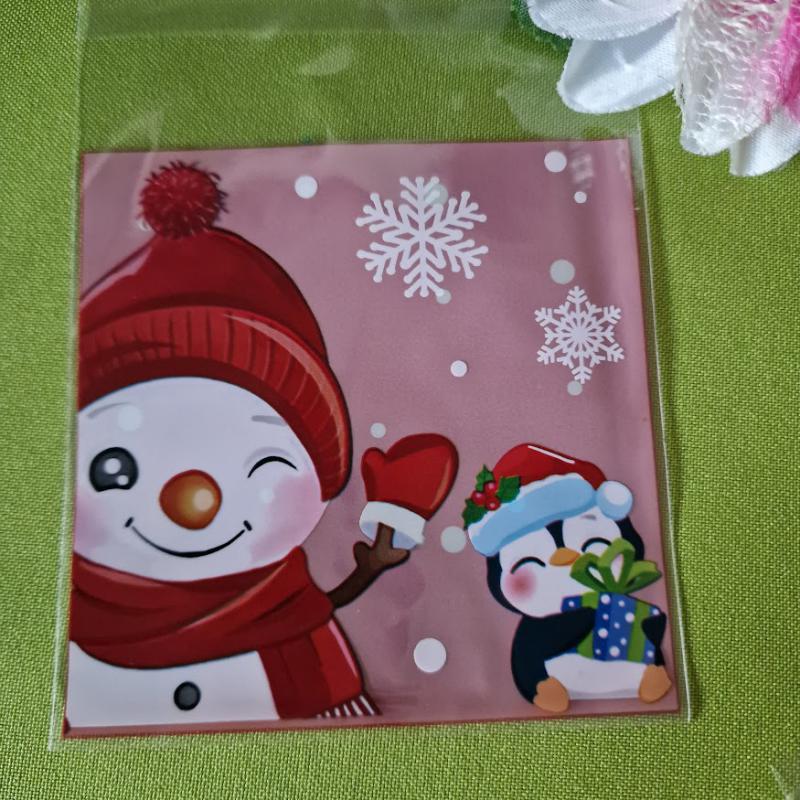 DCS133 - Karácsonyi mintás mikulás tasak - rózsaszín hátuljú/ Hóember és pingvin 10x13cm