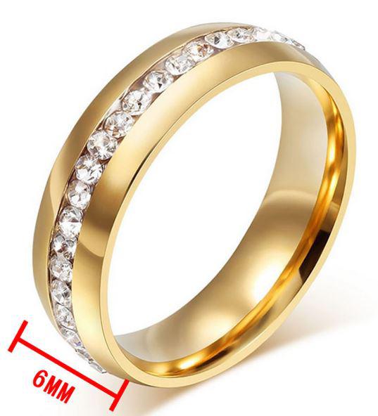 ESKÜVŐ ELJEGYZÉS GYR05 - 1 soros kristály köves arany színű acél karikagyűrű