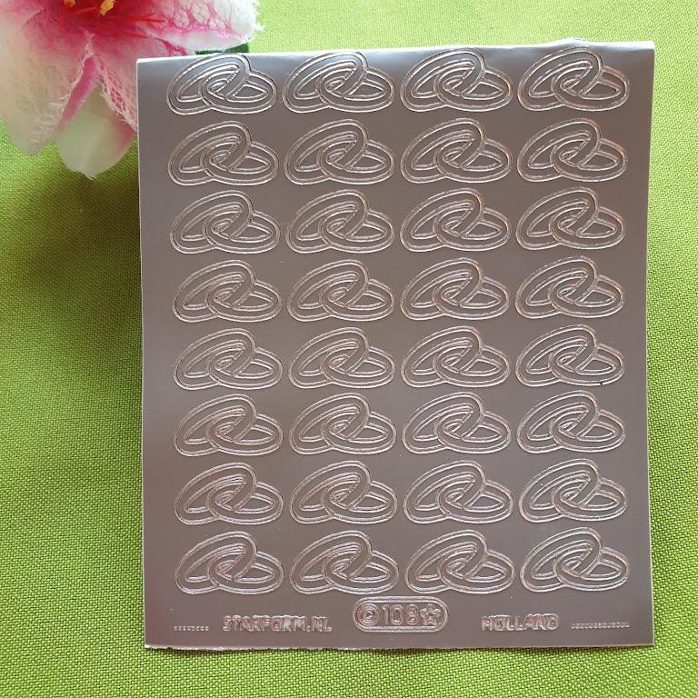 ESKÜVŐ KIEG04 - Ajándék díszítő ezüst színű jegygyűrű matrica