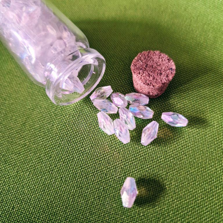 GYÖ10 - 70db AB színű Műanyag gyöngy üvegcsében