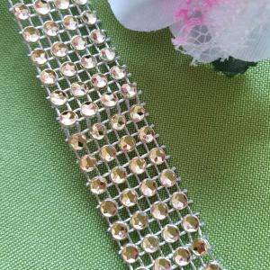 "Strasszöves" arany színű szalag 20mm
