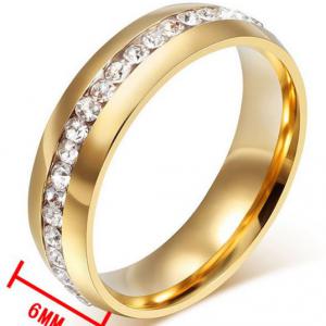 ESKÜVŐ ELJEGYZÉS GYR05 - 1 soros kristály köves arany színű acél karikagyűrű