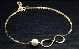 KAR02 - Karkötő, karlánc, végtelen jellel és gyönggyel