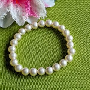 KAR100 - Ekrü színű tekla 8mm-es gyöngyös rugalmas karkötő