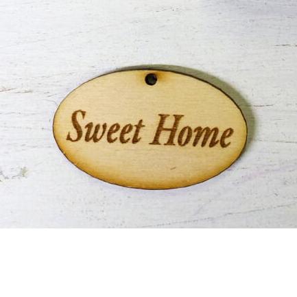 Natúr fa ovális tábla 'Sweet home' felirattal. Mérete: 40x25 mm