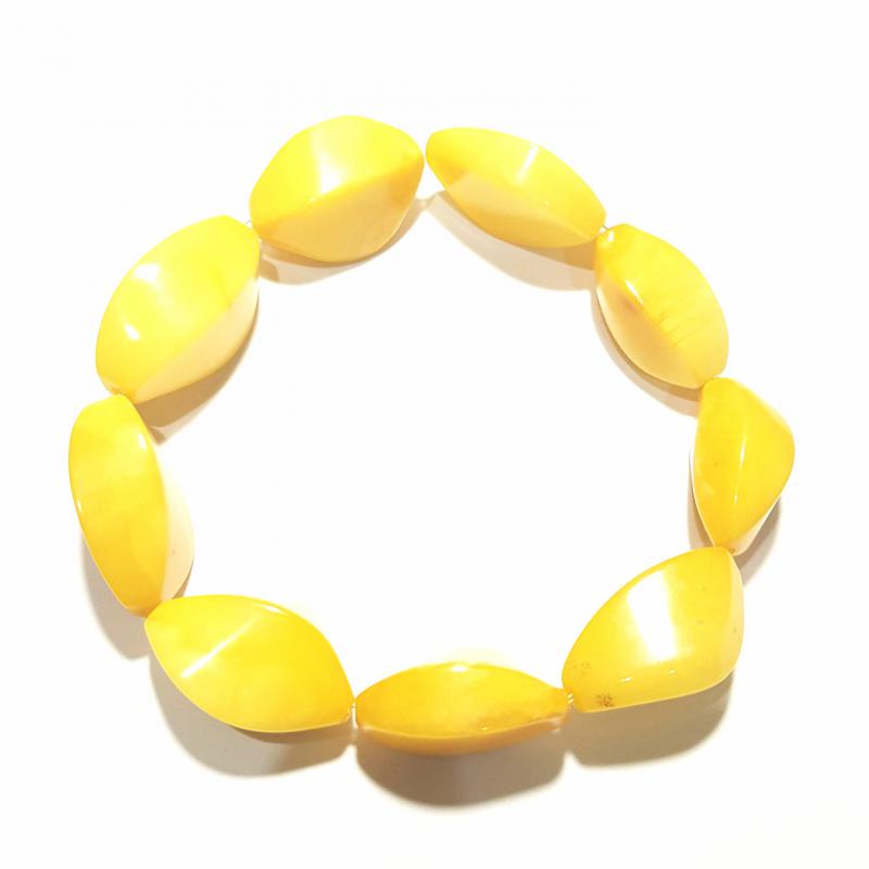 Borostyán karkötő hullámosra csíszolt opak gumis 660