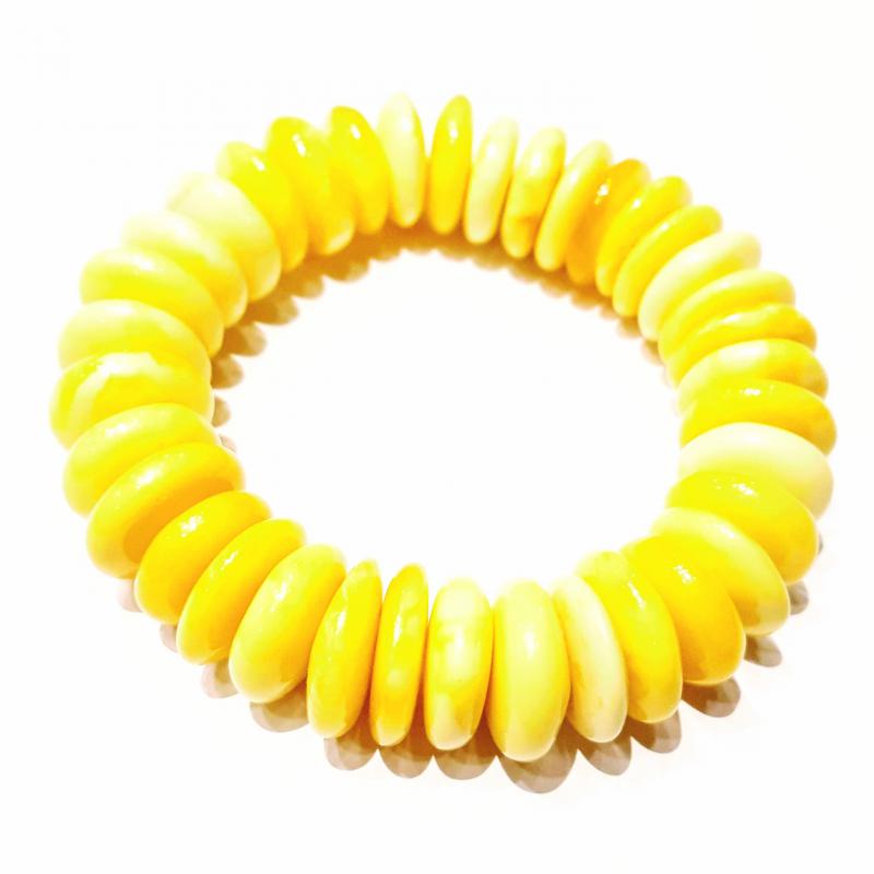 Borostyán karkötő sárga opak korong formályú elemekből 728
