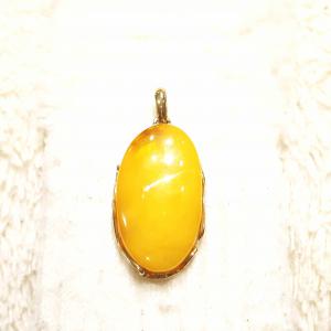 Borostyán medál aranyozott  ezüst foglalatban 608