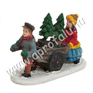 Férfi kocsit húz, fenyőt visz, felesége kiséri